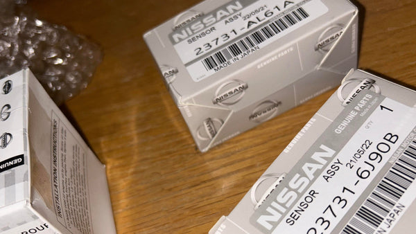 Nissan sensor assembly packaging on a wooden surface